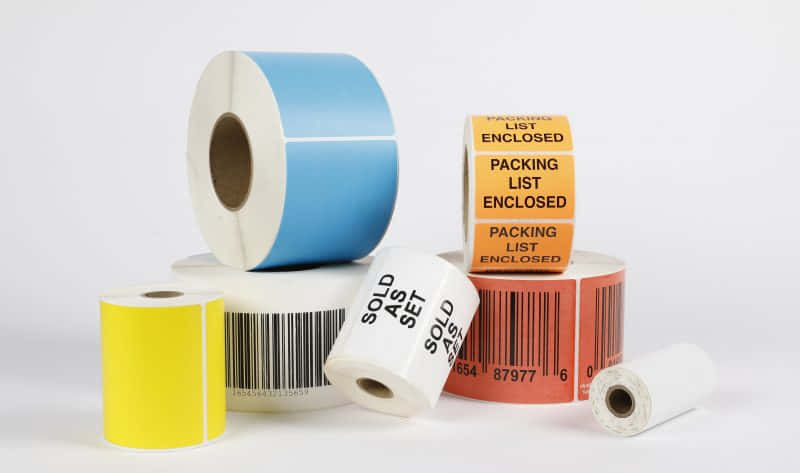 Color and white thermal labels are blank or have barcodes printed on them